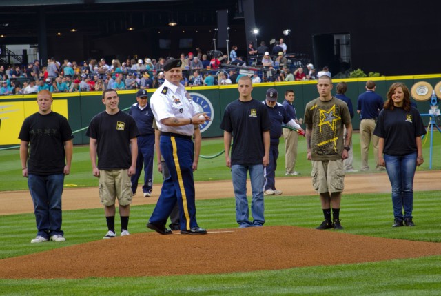 CSM Troxell rifles first pitch across home plate