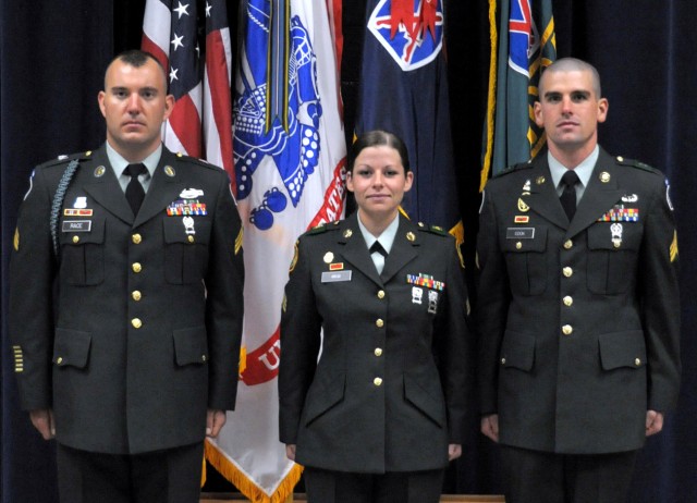 Warrior Leader Course award winners stand to be recognized during their graduation ceremony. From left are Sgt. Jason D. Race, Commandant’s Inspection award recipient; Sgt. Jaclyn Grego, Jared C. Monti Leadership Award winner; and Sgt. Aaron M. Cook,...