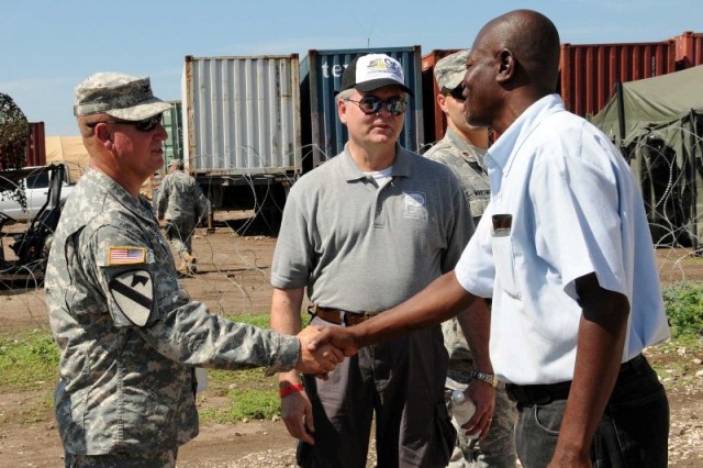 Col. Donnelly meets with director of Ecole Nationale de Mandrin School