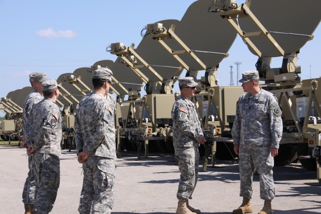 Before a row of Satellite Transportable Terminals, Lt. Col. Michael Snyder, Reserve Officers’ Training Corps (ROTC) Battalion Commander for University of North Ala., (second right) discussed training on the Army’s Warfighter Information...