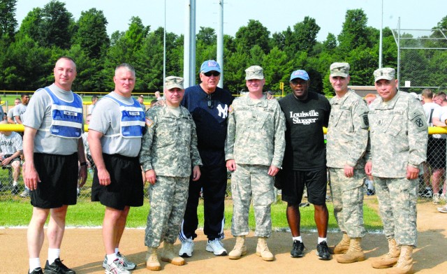 The command team of 2nd Brigade Combat Team, along with leaders from 4th Battalion, 31st Infantry Regiment, and 2nd Battalion, 15th Field Artillery Regiment, pose with baseball legends Tommy John and Vida Blue at a softball game June 28. The Fort...