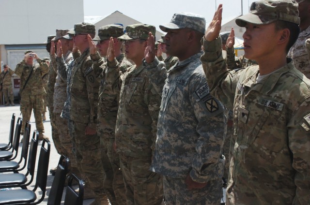 Soldiers recite oath during citizenship ceremony