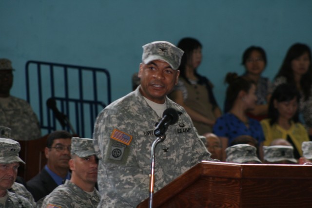 A member of the 36th Korean Service Corps Company holds his unit colors at the 403rd Army Field Support Brigade’s change of command July 8 on Camp Walker, Daegu, Korea. Col. Michael Lopez assumed comm