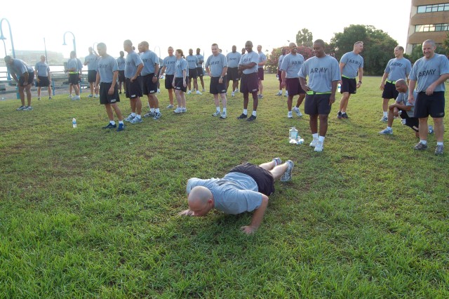 Charleston Company 1st Sgt. leads PT training by example.