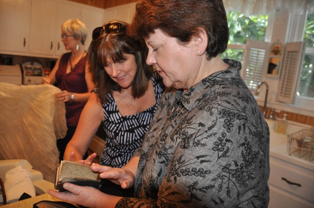 APG Museum Director examines memorabilia from the Zebley attic
