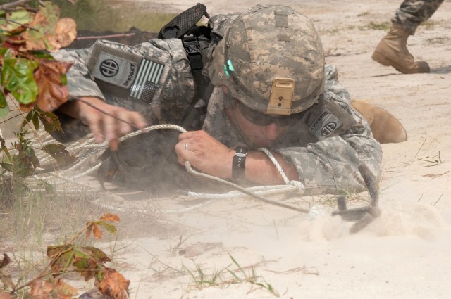 Airborne engineers breach a wire barrier