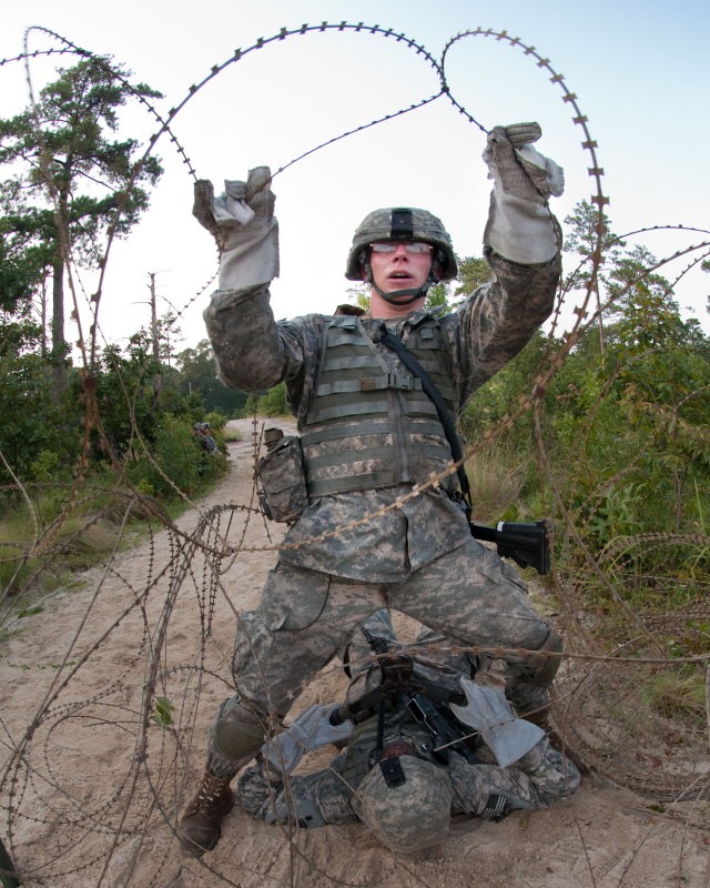 Airborne engineers breach a wire barrier