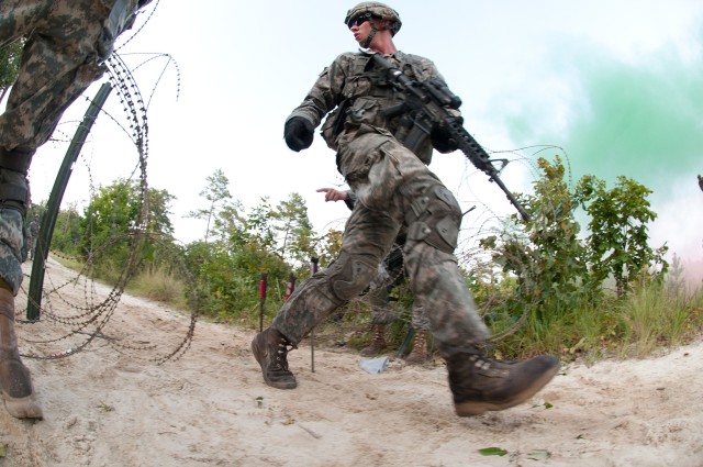 Airborne engineers breach a wire barrier