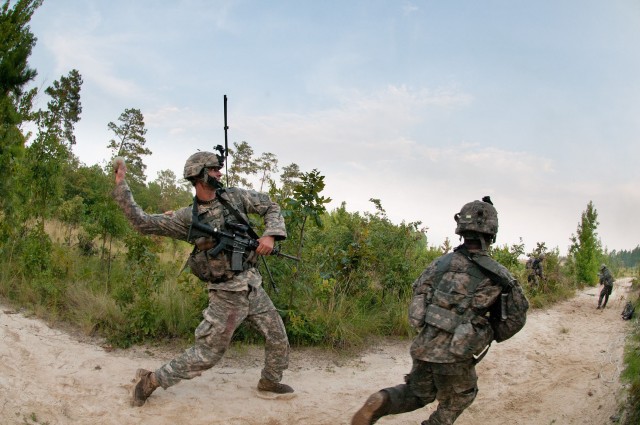 Airborne engineers breach a wire barrier