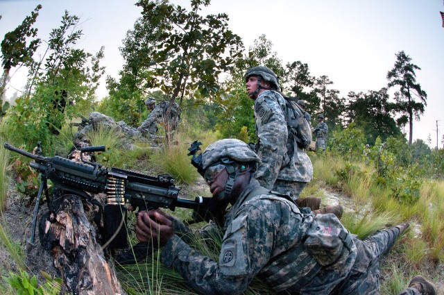 Airborne engineers breach a wire barrier