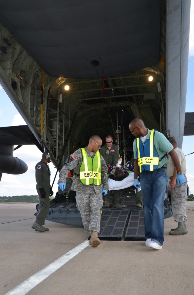 Medevac patient being taken off aircraft