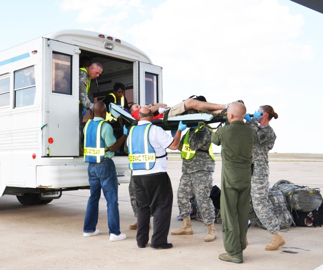 Medevac loading patient onto ambulance