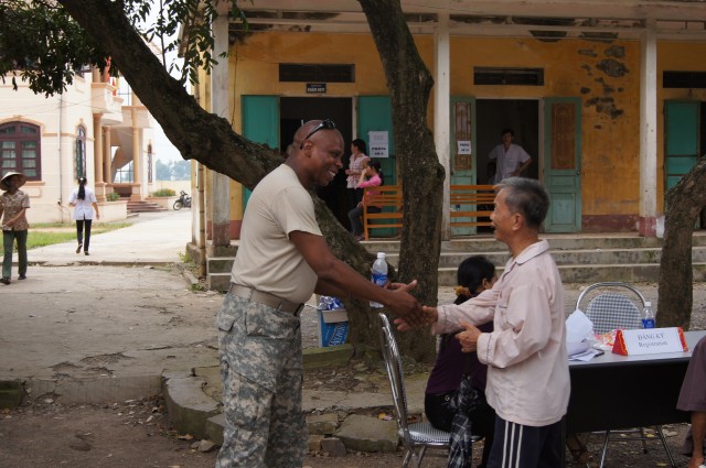 Lt. Col. Davidson greets a Vietnamese local