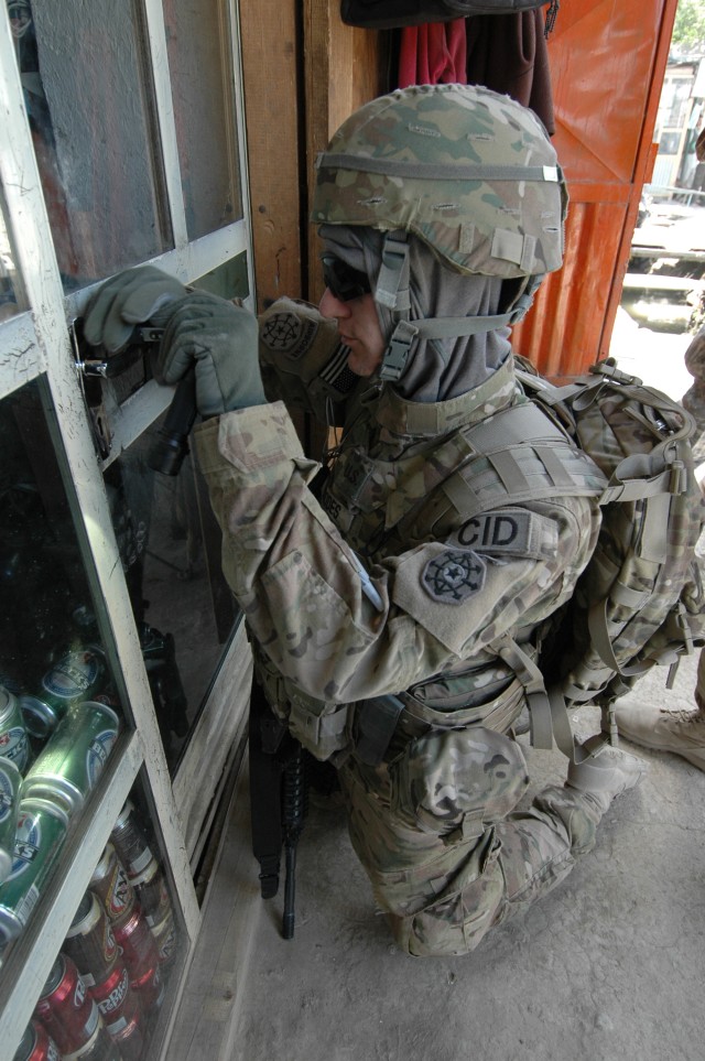 Special Agent Russell Rhodes Picking A Lock During Bagram Raid