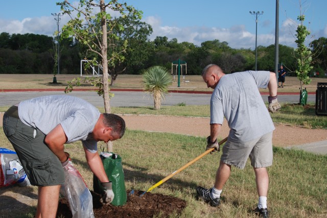 USAEC employees and leaders help mulch trees at John James Park