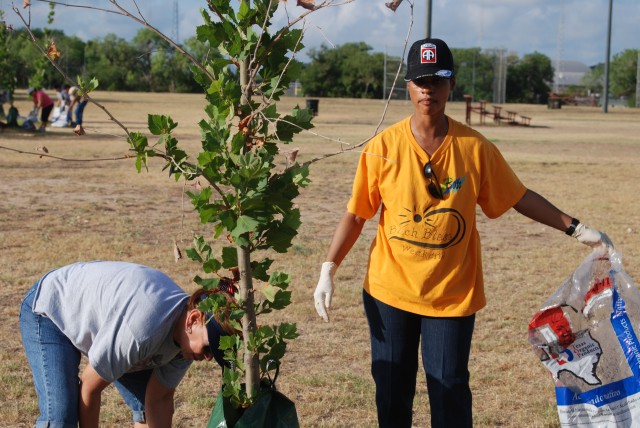 USAEC employees and leaders help mulch trees at John James Park