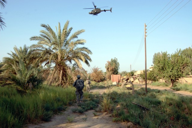 Scouts in Iraq perform airborne missions to uncover weapons caches