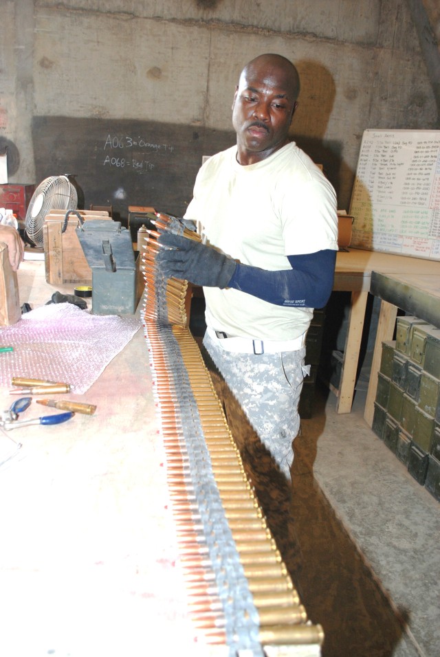 A Soldier inspects ammunition that has been turned in.