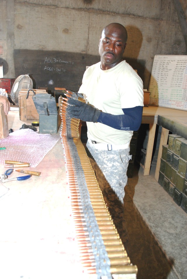 A Soldier inspects ammunition that has been turned in.