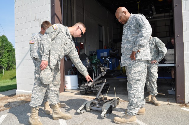 Soldiers check out the NSA Crane EOD's robotic equipment