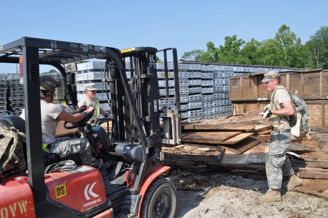 Soldier help clear open storage lot at CAAA