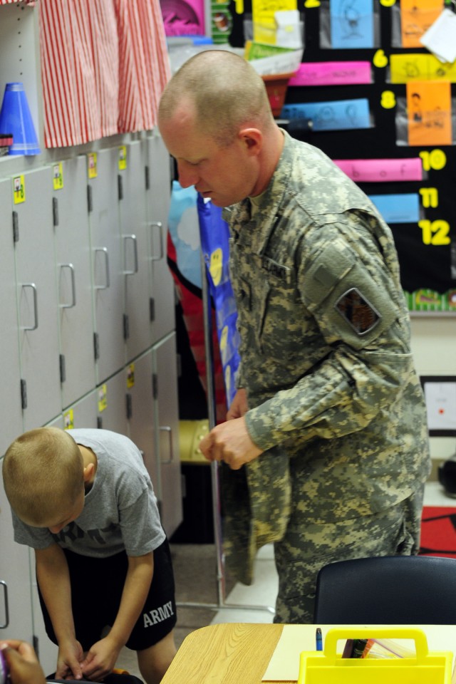 Soldiers, Families bring kids to school for first day