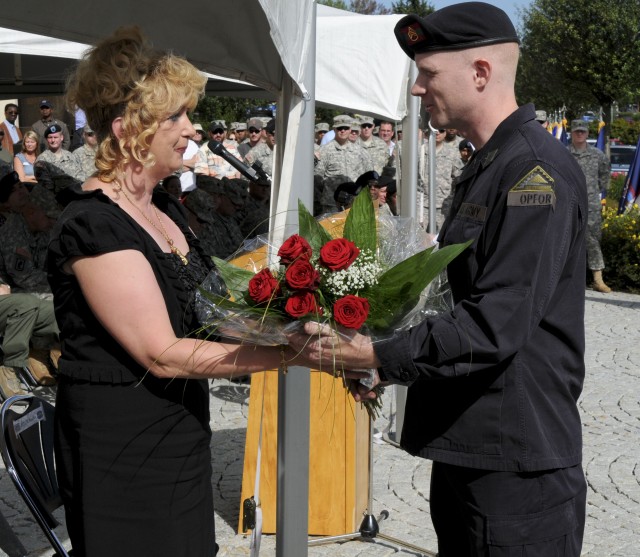 Mrs. Elke Graham receives flowers at JMRC change of responsibility ceremony