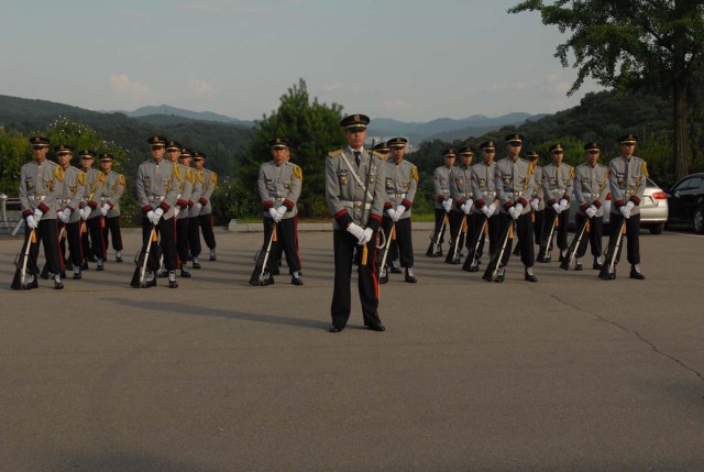 III Corps is presented with honorary baton