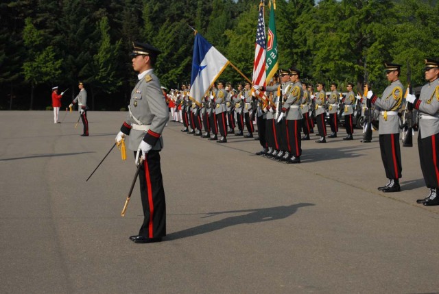 III Corps is presented with honorary baton