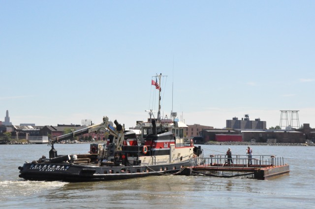 Army Corps drift collection crews work to clear potential hazards to navigation from the harbor after Irene