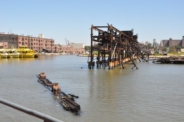 Army Corps drift collection crews work to clear potential hazards to navigation from the harbor after Irene