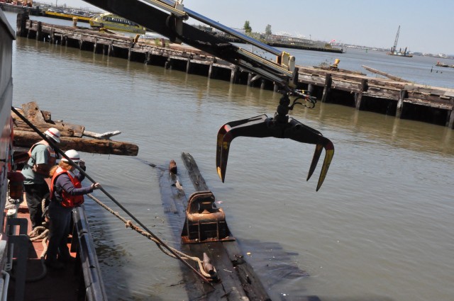 Army Corps drift collection crews work to clear potential hazards to navigation from the harbor after Irene