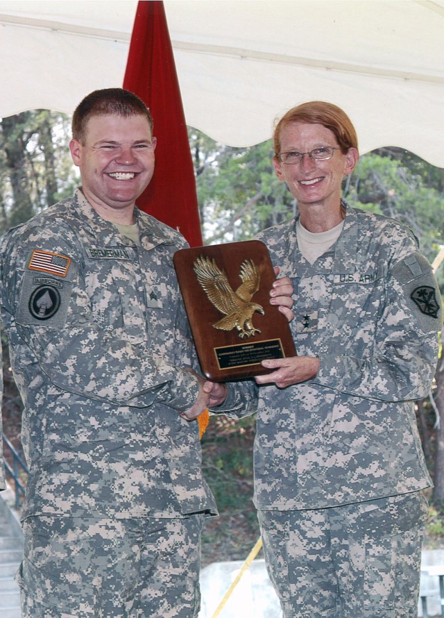 Analyst receives commander's plaque