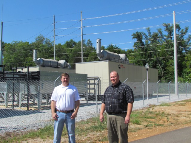 Energy Management Office Personnel For Garrison Stand In Front Of Generators
