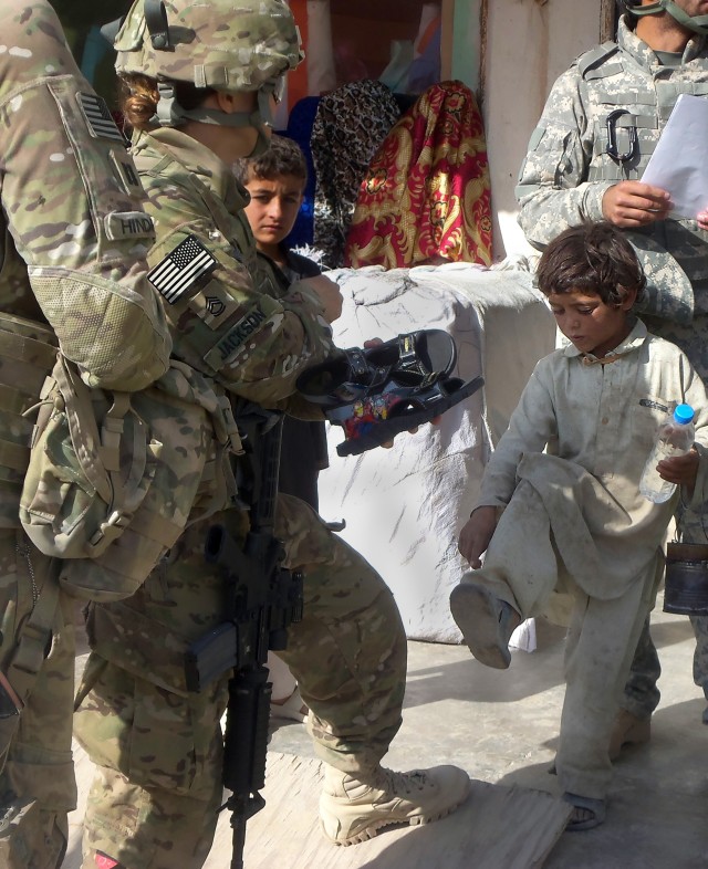 Female engagement team interacts with local citizens