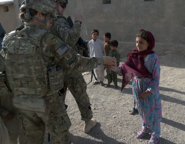 Female engagement team interacts with local citizens