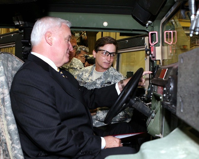 Pennsylvania Governor Tom Corbett sits in the driver seat of one of LEAD's Ground Mobility Vehicles