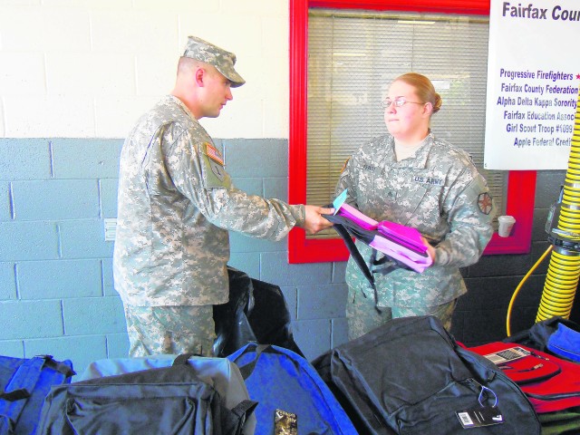 Battalion helps distribute backpacks to schoolchildren