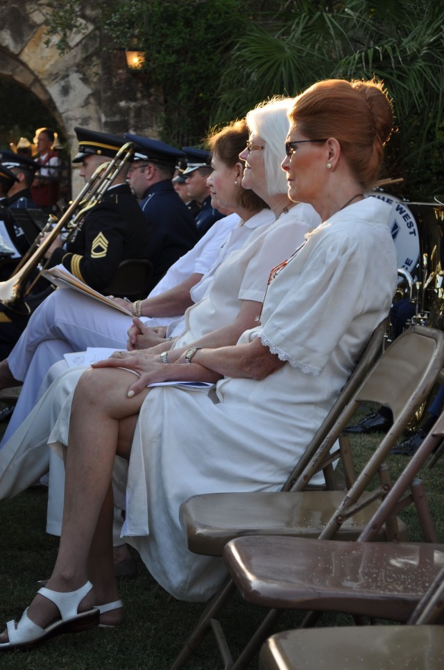 Daughters of the Republic of Texas, in white, sit next to the Joint Air Force and Army Band during San Antonio's commemoration of the 10th anniversary of 9/11.