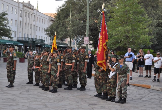 San Antonians join the San Antonio Young Marines in honoring the flag during the Pledge of Allegiance.
