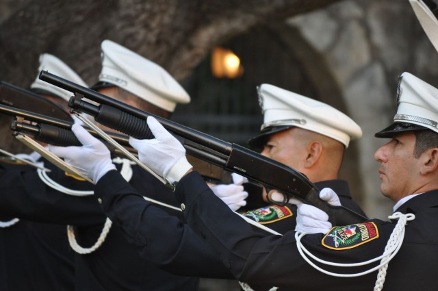 The San Antonio Police Department Honor Guard fires a 21-gun salute to remember the victims of United Airlines Flight 175, which crashed into the South Tower of the World Trade Center.