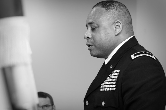 Brig. Gen. Gracus Dunn, Commanding General of the 85th Support Command, takes a few moments in prayer