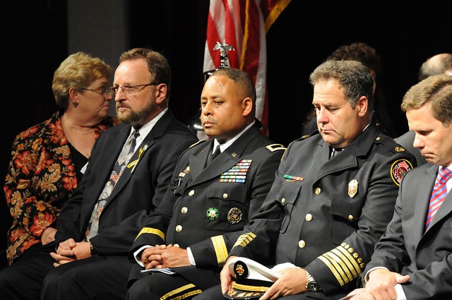 (Left to right) Mr. Wayne Messmer, Brig. Gen. Gracus Dunn, Fire Chief Terrence Vavra, and Congressman Robert Dold reflect during an invocation
