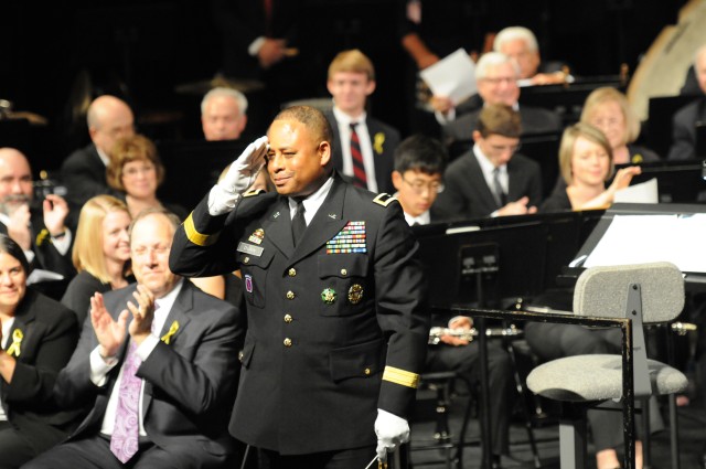 Brig. Gen. Gracus Dunn renders a salute to the audience in return for their applause following his performance.