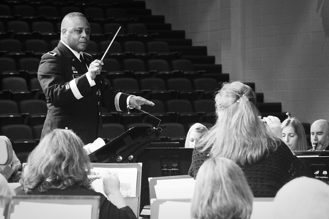 Commanding General of the 85th Support Command, Brig. Gen. Gracus Dunn, rehearses a musical piece with the Buffalo Grove Symphonic Band prior to The Buffalo Grove 9/11 10 year Commemorative event