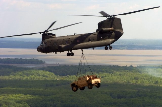 Chinook carrying Humvee via slingload