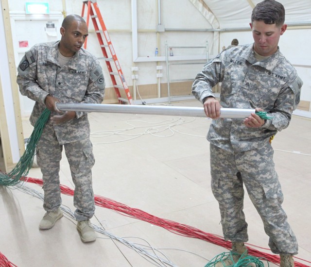 Soldiers Run Cable for Tactical Operations Center Construction