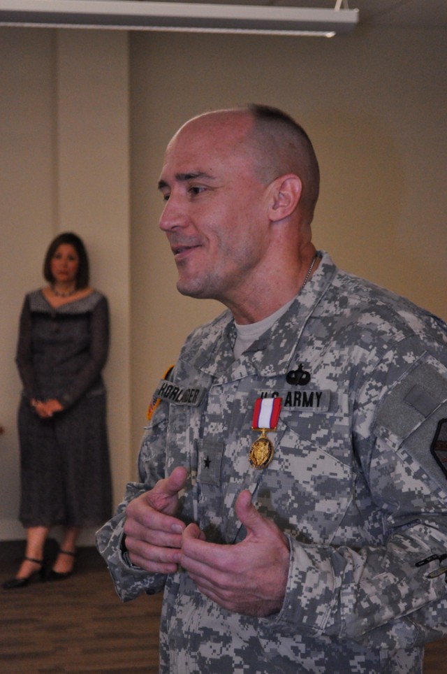 Brig. Gen. Thomas Horlander, outgoing director of resource management/G8 at IMCOM, says thanks to the workforce at an award ceremony Sept. 27.