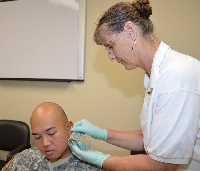 IOP Day Treatment Center doctor gives Acudetox treatment to Soldier