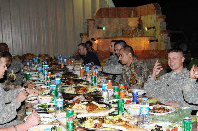 Iraqi Soldiers and U.S. Paratroopers share one last meal together